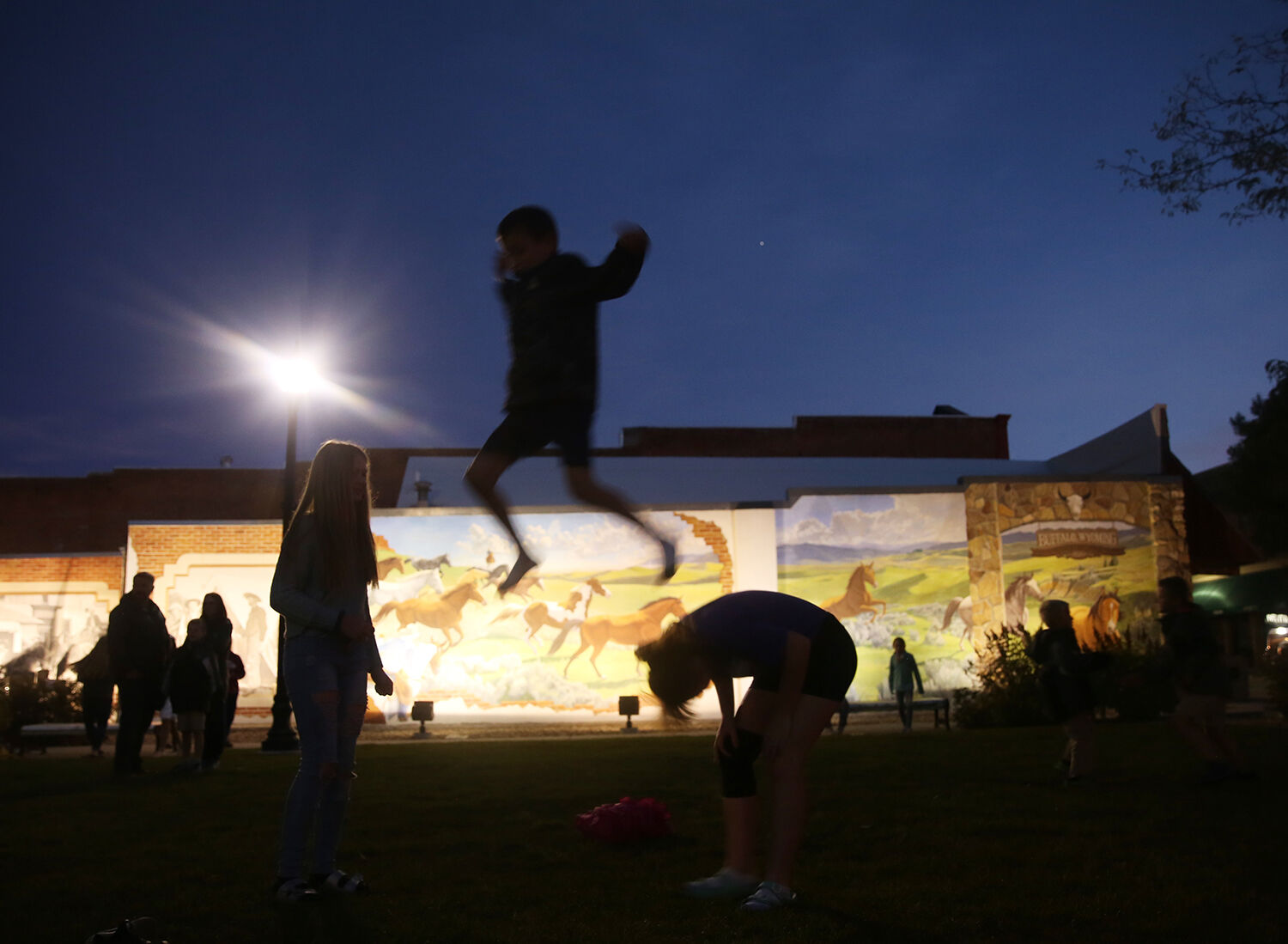Nathan Peterson jumps off Tara Boden’s back after the end of the parade
